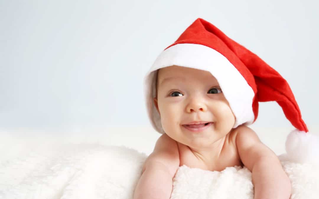 Smiling baby in Santa hat
